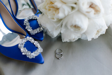 A close up image of elegant floor-length wedding dress. Concept of bride morning.