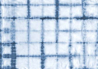 Tie dye shibori pattern. Abstract tie-dye technique hand dyed fabric.