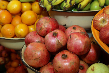 Pomegranate with Orange and Apples on Street Market in Tel Aviv. Israel
