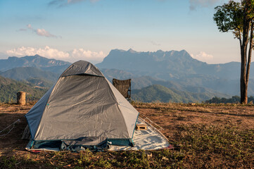 Tent camping on hill with mountain range in national park