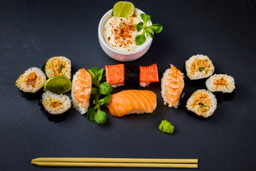 sushi on a stone platter, asian food.