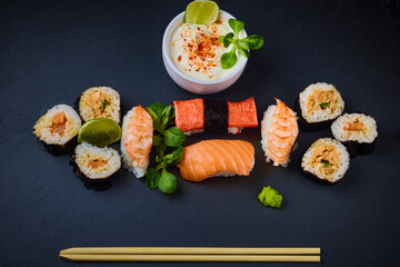 sushi on a stone platter, asian food.