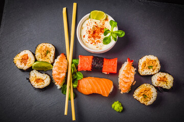 sushi on a stone platter, asian food.