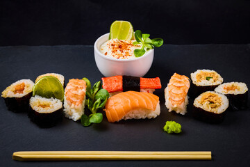 sushi on a stone platter, asian food.