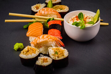 sushi on a stone platter, asian food.