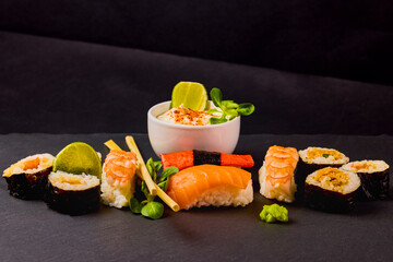 sushi on a stone platter, asian food.