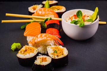 sushi on a stone platter, asian food.