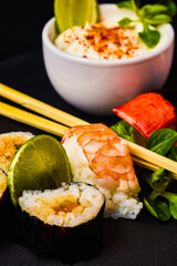 sushi on a stone platter, asian food.