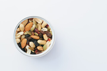 close up of many mixed nuts in a container with copy space 