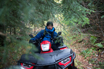 Rescuer Doing Lookout in Woods on a Quad