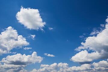 White cumulus clouds in blue sky, beautiful cloudscape background
