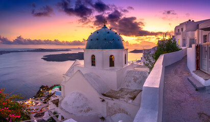 Fantastic Sunset night view of traditional Greek village Fira on Santorini island, Greece, Europe....