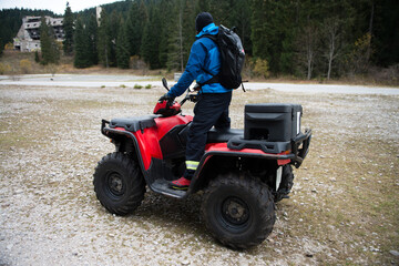 Rescuer on a Quad Bike Searching Missing Person