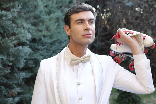 Elegant Male Roller Skater Wearing White Suit