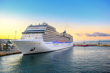 Fototapeta na wymiar A luxury cruise ship arrived at the port at dawn. Floating liner in Europe. Journey.