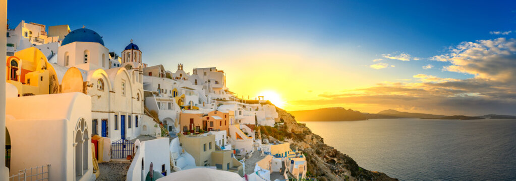 Picturesque sunrise on famous view resort over Oia town on Santorini island, Greece, Europe. famous travel landscape. Summer holidays. Travel concept background.