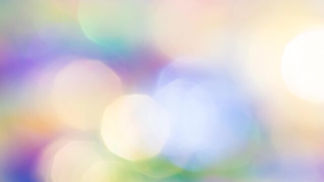 Soft Pastel Bokeh in Motion. Loop. A large number of small sparkling faceted crystals shimmer with all the colors of the rainbow