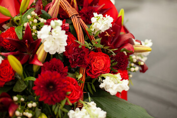 Flowers on memorial. Details of funeral decoration. Bouquet of flowers on grave.