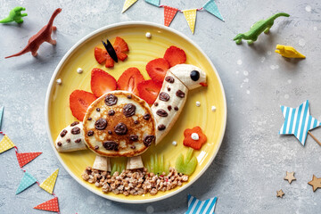 Cute dinosaur shaped pancake. Funny kids breakfast