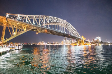 Fototapeta na wymiar Sydeny Harbour Bridge at night, view from a moving tourist boat