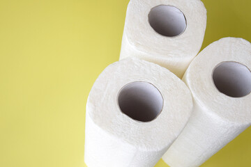 Absorbent paper napkin kitchen towels on yellow background.