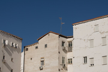 set of white facade buildings with windows