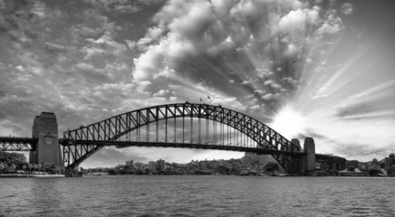 Panoramic sunset view of Sydney Harbour Bridge, Australia.