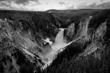 A grayscale shot of forests and canyons