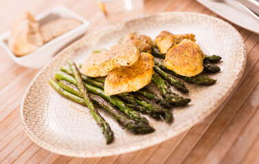 dietary meal rich in protein. Stir fried chicken breast and green asparagus