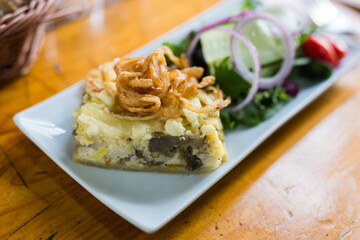 Traditional french pie with bacon and cheese - quiche lorraine, with vegetables