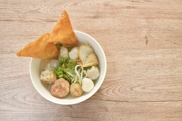 boiled Hakka meatball made from chop pork stuffing fried tofu with bean sprout and lettuce in soup on bowl