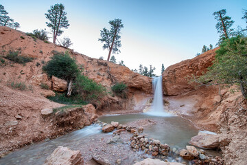 Waterfalls in Mossy Cave Trail at sunset, Bryce Canyon National Park in summer season.