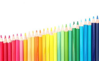 Colored pencils lined up on white paper background. Copy space. Back to school. Office supplies. - Powered by Adobe