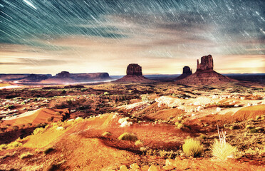 Monument Valley under the stars, night view of famous buttes and valley traffic, very long exposure