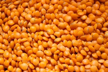 Closeup photo of natural dried red lentils rotating