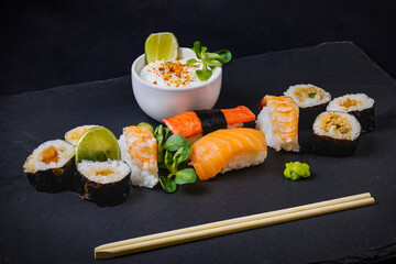 sushi on a stone platter, asian food.