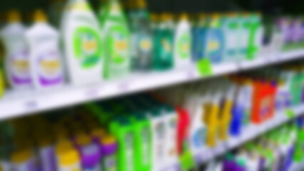 Abstract blur image of supermarket background. Defocused shelves with detergent, washing powder, soap, cleanser. Store. Retail industry. Shelf. Discount price. Inflation. Economic crisis concept.