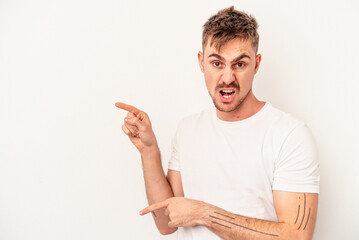 Young caucasian man isolated on white background showing a mobile phone call gesture with fingers.