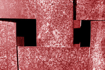 Rusty abstract metal grit construction in red tone.
