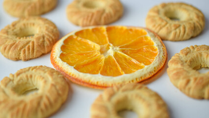 round-shaped cookies and round dry orange slices 