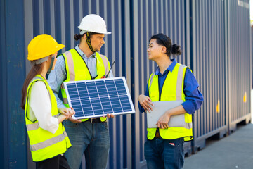 Professional  engineering team technician maintenance service and support of solar panels meeting in container yard. Solar energy, a clean and green alternative energy concept.