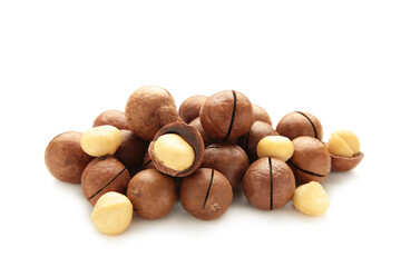 Peeled macadamia nuts. Horizontal composition isolated on white background.