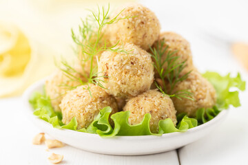 Cheese balls. Portioned appetizer of grated cheese with nuts.