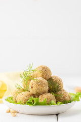 Cheese balls. Portioned appetizer of grated cheese with nuts.