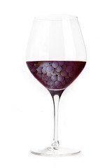 Red wine grapes, dark purple, in a glass, creative collage. Classic cup wineglass, isolated on a white background