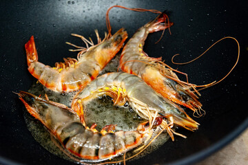 Large raw uncooked prawns or langoustines in shell.