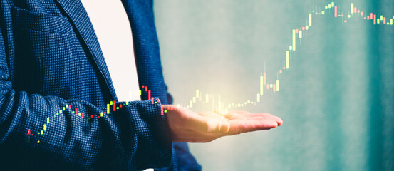 a successful investor, trader, manipulates the direction of the price of stocks, securities, the concept of investment and management, a close-up of the trader's hands