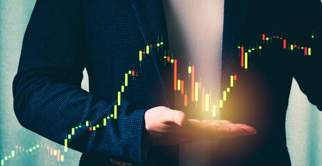 a successful investor, trader, manipulates the direction of the price of stocks, securities, the concept of investment and management, a close-up of the trader's hands
