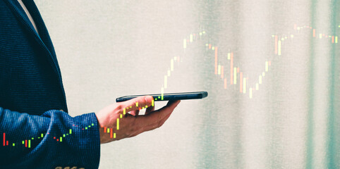 a successful investor, trader, manipulates the direction of the price of stocks, securities, the concept of investment and management, a close-up of the trader's hands