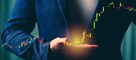 a successful investor, trader, manipulates the direction of the price of stocks, securities, the concept of investment and management, a close-up of the trader's hands